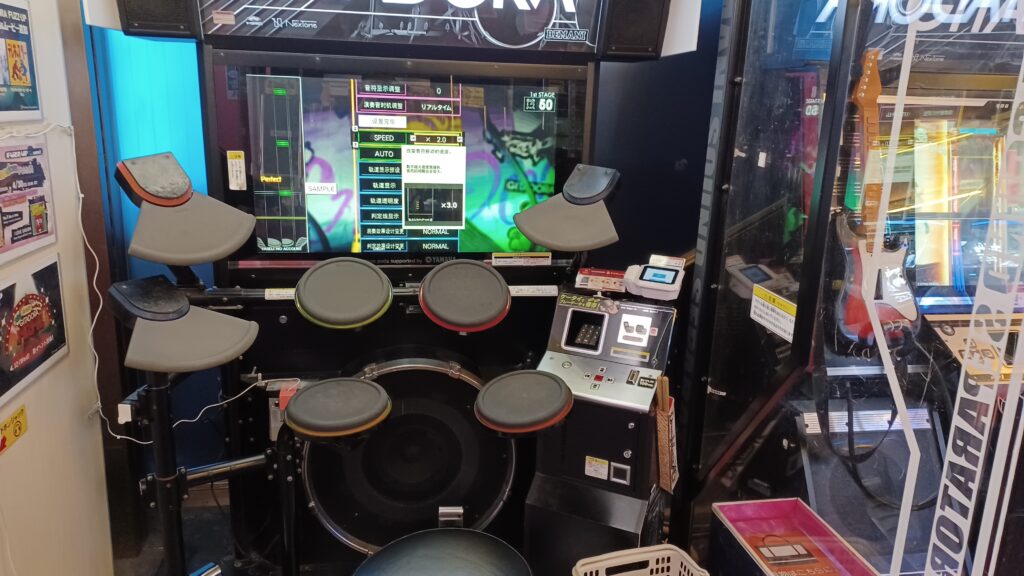 A music game machine with an electronic drum set for playing.