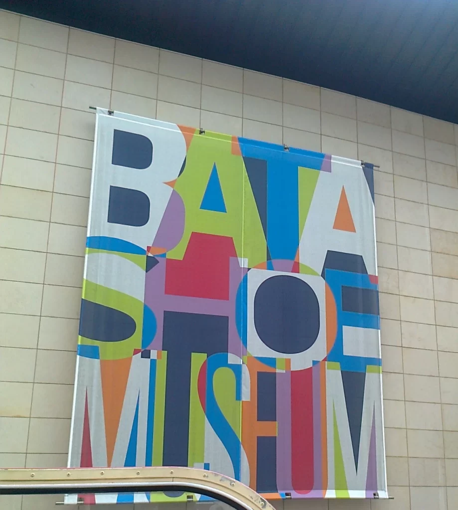 A large colourful poster that says "Bata Shoe Museum".