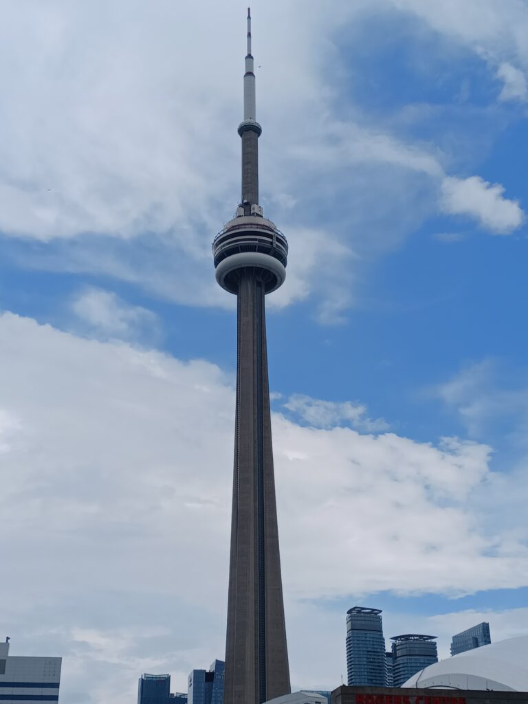 A high concrete tower with 2 circular observation levels and a large antenna at the top.