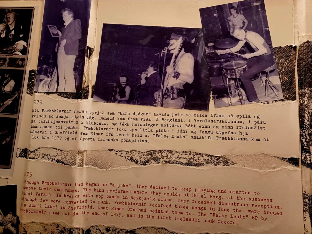 A part of one of walls at the museum. There are some photos of punk bands playing their instruments, and a description of the photos. The first paragraph is in Icelandic and the one underneath is the English translation.